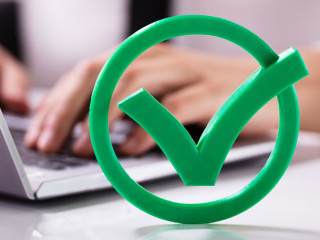 Close-up Of Green Check Mark Sign