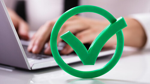 Close-up Of Green Check Mark Sign