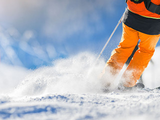 Winter ski sport activities in sunny day. Skier detail panorama