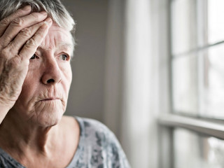 A sad lonely 70 years old senior in is apartment