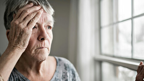 A sad lonely 70 years old senior in is apartment