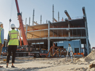 Diverse Team of Specialists Inspect Commercial, Industrial Build