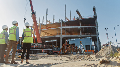 Diverse Team of Specialists Inspect Commercial, Industrial Build