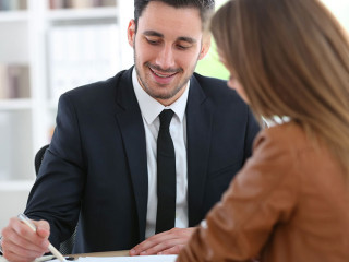 Woman meeting financial adviser in office