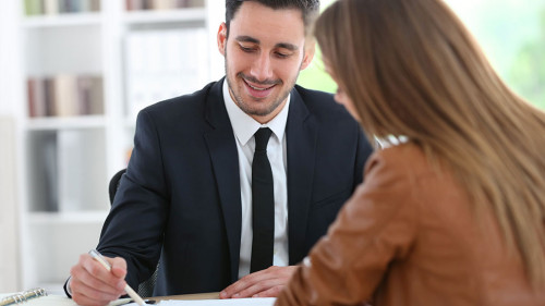 Woman meeting financial adviser in office