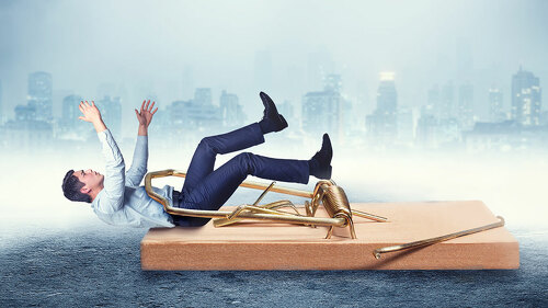 Businessman in the mouse-trap