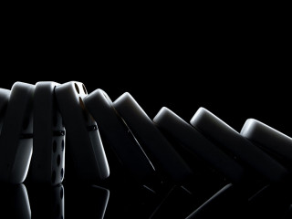 White dominoes in the dark close up