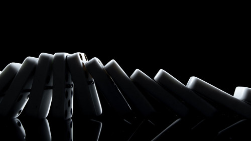 White dominoes in the dark close up