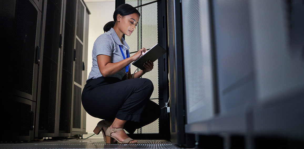 Engineer, server room and woman with tablet for database connection cable, maintenance or software update at night. Cybersecurity, it and female coder with technology for networking in data center.
