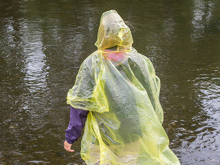Woman with Rain Coat in the Rain