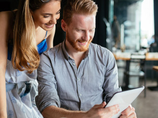 Woman and man flirting in cafe