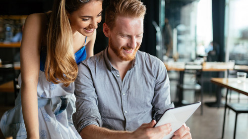 Woman and man flirting in cafe