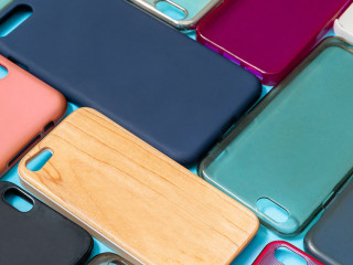 Pile of multicolored plastic back covers for mobile phone. Choic