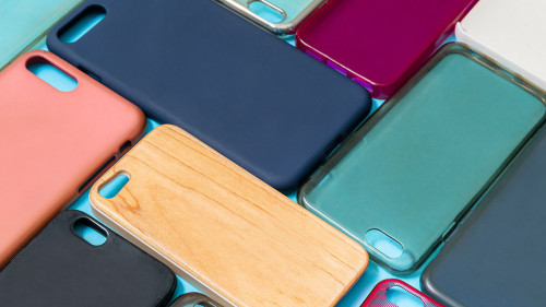 Pile of multicolored plastic back covers for mobile phone. Choic