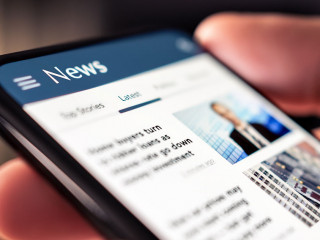 News online in phone. Reading newspaper from website. Digital pu