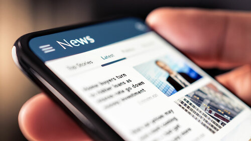 News online in phone. Reading newspaper from website. Digital pu