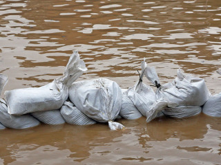 wall of sandbags to fend off raging river