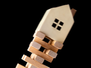 house falling down from a unstable base concept of real estate i