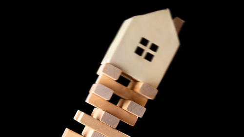 house falling down from a unstable base concept of real estate i
