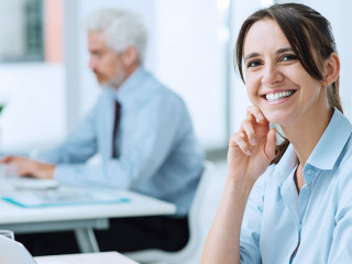 Smiling business woman at work