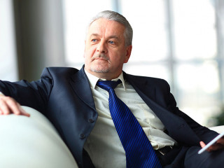 Portrait of a mature businessman with digital tablet
