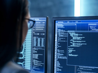 Close-up Shot of Female IT Engineer Working in Monitoring Room.
