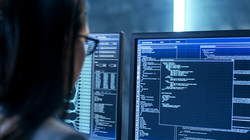 Close-up Shot of Female IT Engineer Working in Monitoring Room.