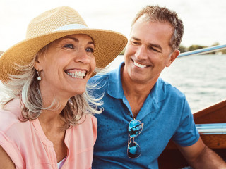 Nothing says summer like a relaxing boat ride. a mature couple enjoying a relaxing boat ride.