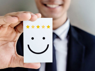 Customer Experience Concept, Happy Businessman holding Card with
