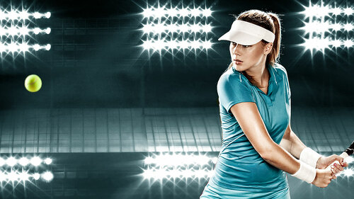 Beautiful sport woman tennis player with racket in blue costume