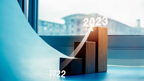 Shining rise up arrow on wood blocks chart steps as a graph from