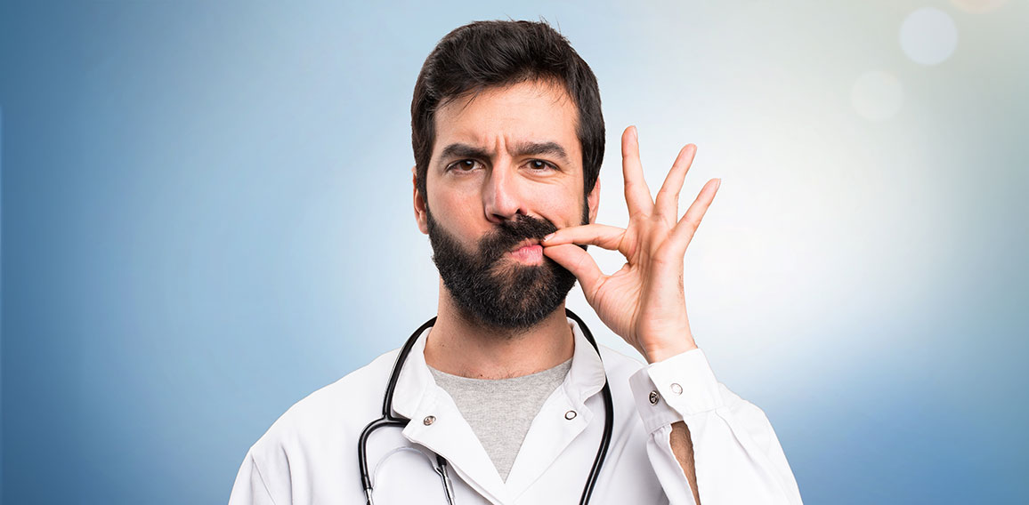 Young doctor making silence gesture on blue background