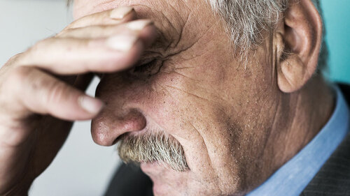 Senior depressed businessman thinking about worries