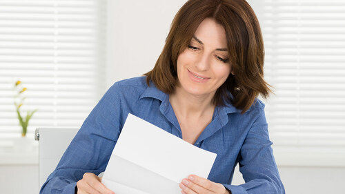 Happy Woman Reading Letter