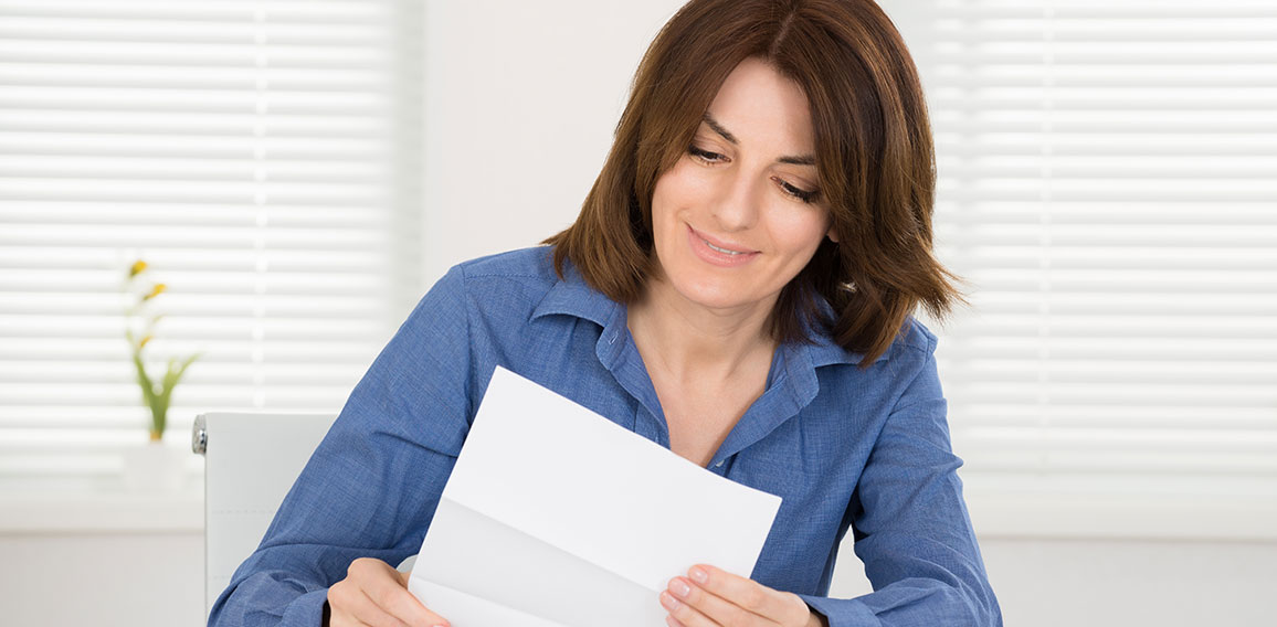 Happy Woman Reading Letter