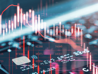 Close up of laptop keyboard and bank card with glowing falling red forex chart on blurry backdrop. Stock exchange and crisis concept. Double exposure.