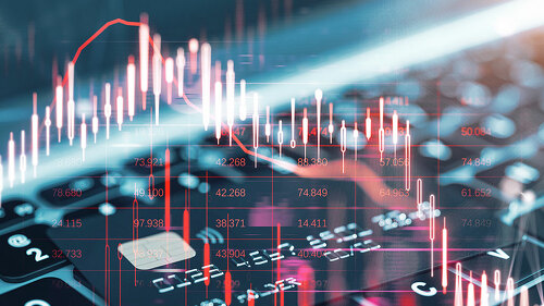 Close up of laptop keyboard and bank card with glowing falling red forex chart on blurry backdrop. Stock exchange and crisis concept. Double exposure.