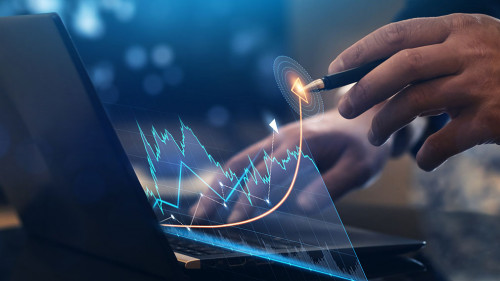 Businessman analysing economic growth graph financial data on la