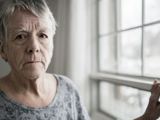 A sad lonely 70 years old senior in is apartment