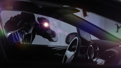 Car Robber with Flashlight