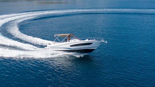 Aerial view of speed motor boat on open sea