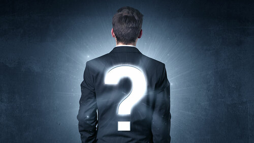 Man standing with question mark on his back
