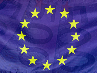 European flag with 500 Euro bills