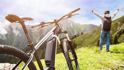 Man Enjoying View After Finishing Uphill Mountain Track