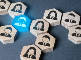 The structure of hexagonal figures with employees is connected together through a blue figure. Establishing contact between business, mediator services. Leader, link. Business organization.