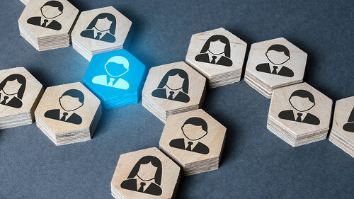 The structure of hexagonal figures with employees is connected together through a blue figure. Establishing contact between business, mediator services. Leader, link. Business organization.