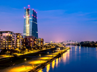 The skyline of Frankfurt, Germany, with the European Central Bank tower at night - All logos and brands removed
