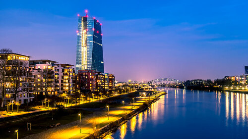 The skyline of Frankfurt, Germany, with the European Central Bank tower at night - All logos and brands removed