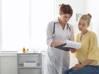 Patient having appointment with doctor in hospital
