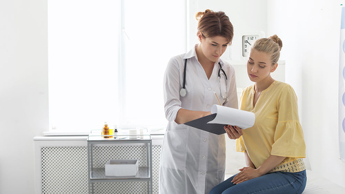 Patient having appointment with doctor in hospital